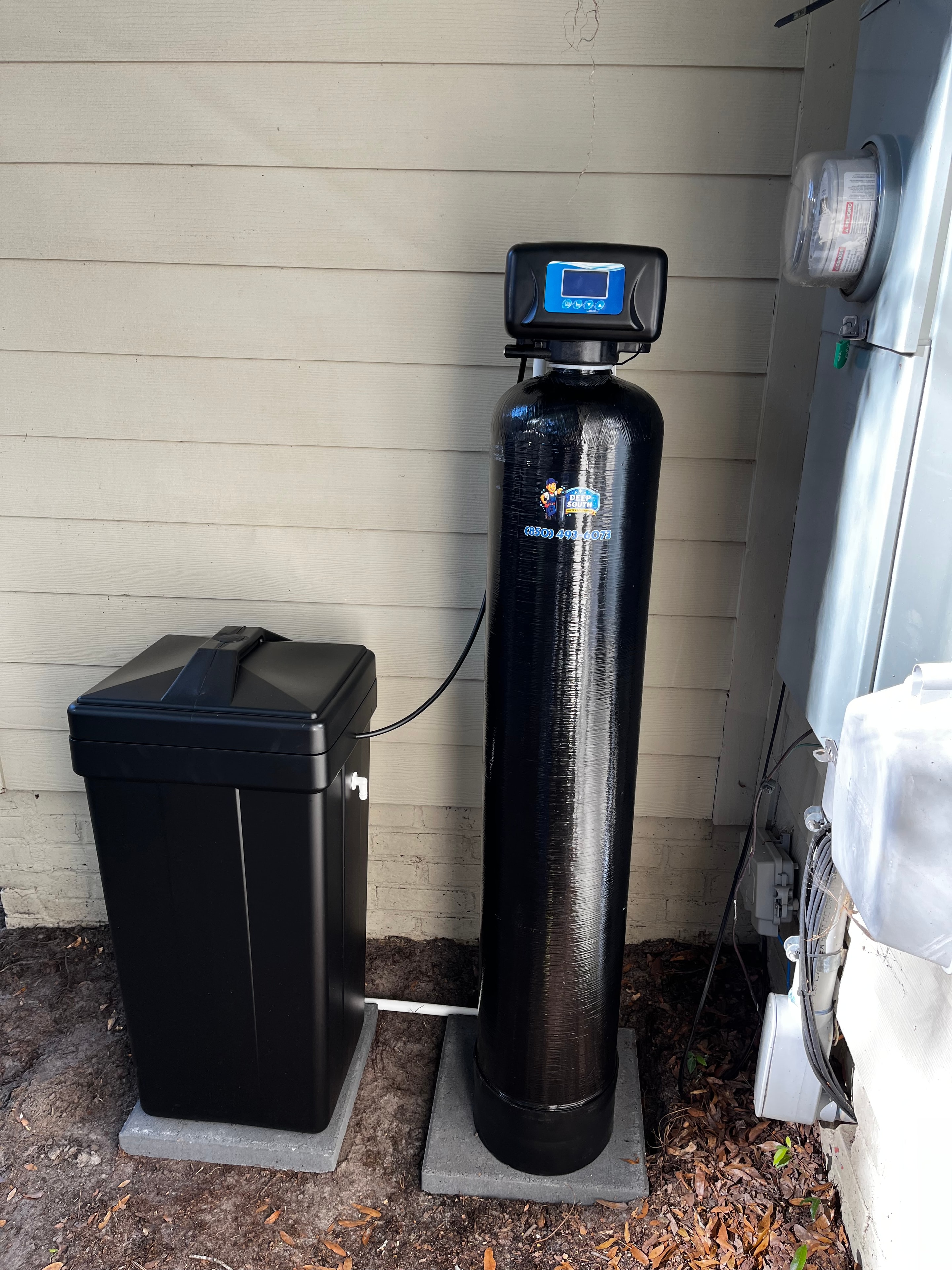 Water treatment system installation by technician